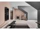 Bonus room with home gym equipment, sloped ceilings, and pink and gray color scheme at 2425 Giles Ln, Mount Pleasant, SC 29466