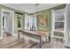 Relaxing dining room offers bench seating, modern chandelier and natural light from large windows at 2425 Giles Ln, Mount Pleasant, SC 29466