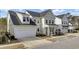 Attractive exterior featuring a two-car garage, lush landscaping, and a well-maintained yard in a residential neighborhood at 2425 Giles Ln, Mount Pleasant, SC 29466