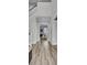 Bright hallway featuring beautiful wood flooring, staircase and modern white trim with views to the bright living room at 2425 Giles Ln, Mount Pleasant, SC 29466