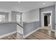 Upstairs hallway featuring neutral walls, wood floors, and natural light at 2425 Giles Ln, Mount Pleasant, SC 29466