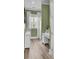 Compact home office has simple white desk and cabinet at 2425 Giles Ln, Mount Pleasant, SC 29466