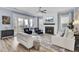 Comfortable living room features modern fireplace, plenty of sunlight, and stylish decor at 2425 Giles Ln, Mount Pleasant, SC 29466