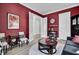 Stylish living room with dark red walls, elegant decor, and plenty of natural light at 2425 Giles Ln, Mount Pleasant, SC 29466