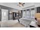 Spacious main bedroom with tray ceilings, large windows, and stylish decor at 2425 Giles Ln, Mount Pleasant, SC 29466