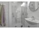 Charming bathroom featuring a glass shower, white cabinets, and modern fixtures at 2514 Myrtle Ave, Sullivans Island, SC 29482