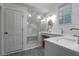 Elegant bathroom with a glass-enclosed shower, double sinks, and marble countertops at 2514 Myrtle Ave, Sullivans Island, SC 29482