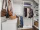 Organized closet featuring built-in shelves and hanging rods for clothing and accessories at 2514 Myrtle Ave, Sullivans Island, SC 29482