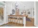 Charming breakfast nook with barstool seating, hardwood floors, and views of the porch at 2514 Myrtle Ave, Sullivans Island, SC 29482