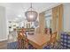 Bright dining room with pendant lighting, wooden table and views of the kitchen at 2514 Myrtle Ave, Sullivans Island, SC 29482