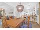 Open-concept dining room featuring seating for eight and views of the living room and kitchen at 2514 Myrtle Ave, Sullivans Island, SC 29482