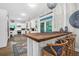 Bright kitchen area featuring stainless steel appliances, pendant lighting, and a breakfast bar at 2514 Myrtle Ave, Sullivans Island, SC 29482