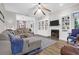Comfortable living room with fireplace, built in shelving and plush sectional sofa at 2514 Myrtle Ave, Sullivans Island, SC 29482