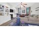Comfortable living room featuring a fireplace, built in shelving and view of the dining room at 2514 Myrtle Ave, Sullivans Island, SC 29482