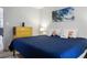 Bright bedroom with a comfy bed and a yellow dresser in the room at 278 Driftwood Ln, Edisto Island, SC 29438