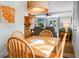 Inviting dining space flows into the cozy living area with a fireplace, perfect for relaxation at 278 Driftwood Ln, Edisto Island, SC 29438