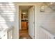 Condo entry showing kitchen with wood cabinets and neutral walls at 278 Driftwood Ln, Edisto Island, SC 29438