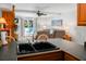 Open-concept layout showcasing a kitchen island with a sink and views into the cozy living area at 278 Driftwood Ln, Edisto Island, SC 29438