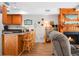 Inviting living space features an open layout, seamlessly connecting to a cozy fireplace and the kitchen at 278 Driftwood Ln, Edisto Island, SC 29438