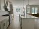 Open-concept kitchen featuring a kitchen island, stainless steel appliances and open floorplan at 2988 Lodge Berry Ln, Johns Island, SC 29455