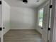 Bright office with white walls and wood floors with double glass paned doors at 2988 Lodge Berry Ln, Johns Island, SC 29455