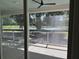 Enjoy the outdoors bug free from the screened porch with views of the backyard pond at 2988 Lodge Berry Ln, Johns Island, SC 29455