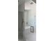 Large walk-in shower with white tile features a seamless glass door and wall-mounted shower at 2988 Lodge Berry Ln, Johns Island, SC 29455