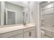Bright bathroom with a white vanity, sink, large mirror, and a shower-tub combo at 3092 Emma Ln, Mount Pleasant, SC 29466
