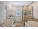 Beautiful bathroom featuring a tiled shower, soaking tub, and a neutral color palette at 3092 Emma Ln, Mount Pleasant, SC 29466