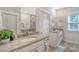 Elegant bathroom with dual sinks, granite countertops, and modern fixtures at 3092 Emma Ln, Mount Pleasant, SC 29466