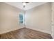 Bright bedroom features hardwood floors, neutral walls, a window, and a ceiling fan at 3092 Emma Ln, Mount Pleasant, SC 29466