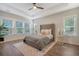 Bright bedroom with a tufted headboard, large windows, and ample natural light at 3092 Emma Ln, Mount Pleasant, SC 29466