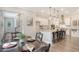 Well appointed dining room with view into a kitchen with an island and barstool seating at 3092 Emma Ln, Mount Pleasant, SC 29466