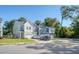 Exterior view of townhouse with gray siding and 2 car garage at 3092 Emma Ln, Mount Pleasant, SC 29466