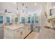 Well-lit kitchen island with barstool seating and modern amenities at 3092 Emma Ln, Mount Pleasant, SC 29466