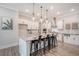 Bright kitchen with a large island, stainless steel appliances, ample counter space, and stylish pendant lighting at 3092 Emma Ln, Mount Pleasant, SC 29466