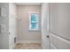 Practical laundry room with tiled floors and ample light at 3092 Emma Ln, Mount Pleasant, SC 29466