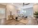 Relaxing living room with comfortable seating, neutral colors, and a large window at 3092 Emma Ln, Mount Pleasant, SC 29466