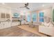 Comfortable living room showcasing a fireplace, built-in cabinets and lots of natural light at 3092 Emma Ln, Mount Pleasant, SC 29466