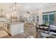 Open-concept living space features a modern kitchen, dining area, and living room, perfect for entertaining guests at 3092 Emma Ln, Mount Pleasant, SC 29466