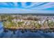 Wide aerial shot showing community homes near a body of water, highlighting the neighborhood's layout at 339 Cicadas Song, Moncks Corner, SC 29461