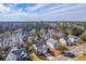 Aerial view of homes with water view, showcasing a peaceful community nestled by a serene lake at 339 Cicadas Song, Moncks Corner, SC 29461