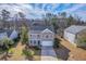 Aerial front view of the home with a two-story porch and large driveway at 339 Cicadas Song, Moncks Corner, SC 29461