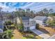 Aerial view of the home featuring a long driveway and pond in the backyard at 339 Cicadas Song, Moncks Corner, SC 29461