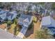 Aerial shot of the home in a quaint neighborhood with mature trees and landscaping at 339 Cicadas Song, Moncks Corner, SC 29461