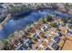 Aerial perspective of homes nestled around a pond showing serene landscapes and neighborhood planning at 339 Cicadas Song, Moncks Corner, SC 29461
