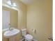 Cozy half-bath with pedestal sink and toilet at 339 Cicadas Song, Moncks Corner, SC 29461