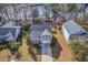 Charming two-story home with gray roof, a front porch, and a well-maintained yard, near the water at 339 Cicadas Song, Moncks Corner, SC 29461