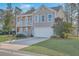 Charming two-story home with a front porch, a second story balcony and an attached garage at 339 Cicadas Song, Moncks Corner, SC 29461