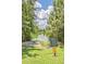 Community kayak launch to a serene lake, surrounded by lush greenery and a sunny sky at 339 Cicadas Song, Moncks Corner, SC 29461